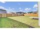 Large, fenced backyard with a concrete pad, perfect for outdoor activities and entertaining at 545 Wayton Cir, Moncks Corner, SC 29461