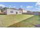 Fenced backyard with grass and a patio at 545 Wayton Cir, Moncks Corner, SC 29461