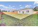 A well-maintained backyard with a wooden fence and sliding glass doors to the home at 545 Wayton Cir, Moncks Corner, SC 29461