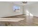 Sunlit bedroom featuring hardwood floors, large window and ceiling fan at 545 Wayton Cir, Moncks Corner, SC 29461