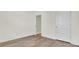 Bedroom with light walls, and laminate wood flooring with doors at 545 Wayton Cir, Moncks Corner, SC 29461