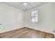 Bedroom with light walls, and laminate wood flooring with window at 545 Wayton Cir, Moncks Corner, SC 29461