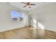 Bedroom features hardwood floors, a window, and access to an outdoor porch at 545 Wayton Cir, Moncks Corner, SC 29461
