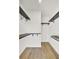 Walk-in closet with built-in shelving and hardwood floors at 545 Wayton Cir, Moncks Corner, SC 29461
