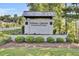 A stately community sign for Spring Grove Plantation with manicured landscaping at 545 Wayton Cir, Moncks Corner, SC 29461