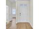 Bright hallway with wood floor leading from front door to other rooms of the house at 545 Wayton Cir, Moncks Corner, SC 29461