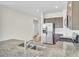 Kitchen featuring stainless steel appliances and hardwood floors and view into other rooms at 545 Wayton Cir, Moncks Corner, SC 29461