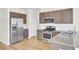 A modern kitchen with stainless steel appliances, granite countertops, and wood flooring at 545 Wayton Cir, Moncks Corner, SC 29461