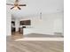 Bright living room with hardwood floors, a modern lighting fixture and eat-in kitchen at 545 Wayton Cir, Moncks Corner, SC 29461