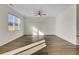 Bright, open-concept living room with hardwood floors and large windows at 545 Wayton Cir, Moncks Corner, SC 29461