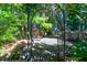 Backyard outdoor seating area with fire pit and mature trees at 794 Hunt Club Run, Charleston, SC 29414