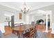 Well-lit dining area showcases chandelier lighting and connects to the kitchen at 794 Hunt Club Run, Charleston, SC 29414