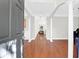 Inviting foyer with hardwood floors, decorative columns, and natural light at 794 Hunt Club Run, Charleston, SC 29414