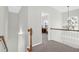 Second floor hallway with wooden railing and chandelier at 794 Hunt Club Run, Charleston, SC 29414