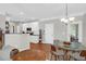 Bright kitchen with white cabinets, and a breakfast area with natural light at 794 Hunt Club Run, Charleston, SC 29414