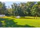 Scenic pond view surrounded by lush greenery, offering a tranquil and picturesque setting for relaxation at 794 Hunt Club Run, Charleston, SC 29414