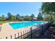 Relax by the sparkling community pool, surrounded by lush greenery and ample seating for a perfect day outdoors at 794 Hunt Club Run, Charleston, SC 29414