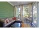 Cozy screened porch with comfortable seating, pillows, and a glass top table at 794 Hunt Club Run, Charleston, SC 29414