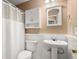 Bathroom featuring a toilet, pedestal sink, and a shower with a shower curtain at 8108 Halifax Way, North Charleston, SC 29420