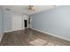 Spacious bedroom featuring hardwood floors, a closet, and a door to the outside at 8108 Halifax Way, North Charleston, SC 29420