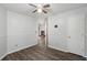 Inviting bedroom features hardwood floors, a ceiling fan, and an doorway into the living room at 8108 Halifax Way, North Charleston, SC 29420