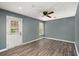 Stylish bedroom offering a door to the outside and a ceiling fan to keep you cool at 8108 Halifax Way, North Charleston, SC 29420
