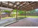 Covered patio with brick flooring and wood pergola at 8108 Halifax Way, North Charleston, SC 29420