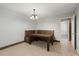 Dining area with built-in wooden bench seating underneath a modern chandelier at 8108 Halifax Way, North Charleston, SC 29420