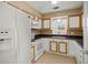 Well-lit kitchen with white appliances and cabinets, featuring a window above the sink at 8108 Halifax Way, North Charleston, SC 29420