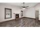 The living room features dark wood floors, a ceiling fan, two windows, and a brick fireplace at 8108 Halifax Way, North Charleston, SC 29420
