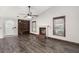 Living room featuring beautiful dark wood floors, a fireplace, and a statement wood accent wall at 8108 Halifax Way, North Charleston, SC 29420