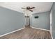 Well-lit living room features a ceiling fan and wood-look flooring at 8108 Halifax Way, North Charleston, SC 29420