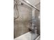 Tiled shower stall with glass doors and a shower seat niche at 8108 Halifax Way, North Charleston, SC 29420