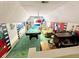 Spacious bonus room with movie decor, pool table, seating area, and a bar at 8496 Roanoke Dr, North Charleston, SC 29406