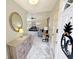 Welcoming entryway with stylish console, ornate mirror, and an open view into the comfortable living space beyond at 8496 Roanoke Dr, North Charleston, SC 29406