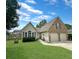 Charming single-story home boasts a well-manicured lawn and a two-car garage, offering both curb appeal and functionality at 8496 Roanoke Dr, North Charleston, SC 29406