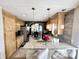 Open kitchen with granite counters, stainless appliances, pendant lighting, and seamless flow to the breakfast nook at 8496 Roanoke Dr, North Charleston, SC 29406