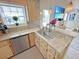 Bright kitchen featuring granite countertops, a stainless steel dishwasher, and modern pendant lighting at 8496 Roanoke Dr, North Charleston, SC 29406