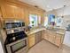 This kitchen features stainless steel appliances, granite countertops, and a stylish backsplash at 8496 Roanoke Dr, North Charleston, SC 29406