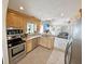Kitchen features stainless appliances, granite countertops, and flows into the bright living area at 8496 Roanoke Dr, North Charleston, SC 29406