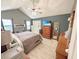 Tranquil main bedroom with a ceiling fan and an en-suite bathroom at 8496 Roanoke Dr, North Charleston, SC 29406