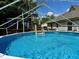 Inviting pool with clear blue water, surrounding deck, covered gazebo and backyard views at 8496 Roanoke Dr, North Charleston, SC 29406