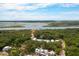 Stunning aerial view of a luxurious community surrounded by lush greenery and waterfront views at 9017 Stern Aly, Johns Island, SC 29455