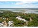 Breathtaking aerial perspective showcasing a community nestled amidst trees with stunning views of the waterfront at 9017 Stern Aly, Johns Island, SC 29455