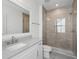 Bathroom featuring a glass enclosed shower, sleek vanity, and patterned floors at 9017 Stern Aly, Johns Island, SC 29455