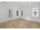 Spacious bedroom featuring hardwood floors, white walls, and access to the outside at 9017 Stern Aly, Johns Island, SC 29455
