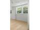 Bright bedroom with wood flooring and ample natural light from many windows at 9017 Stern Aly, Johns Island, SC 29455