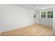 A bedroom with natural light, neutral walls, and hardwood floors at 9017 Stern Aly, Johns Island, SC 29455