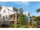 Charming white exterior with double porches, landscaped yard, and coastal vibe at 9017 Stern Aly, Johns Island, SC 29455
