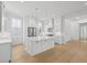 A kitchen with stainless appliances, quartz countertops, and bright, natural light at 9017 Stern Aly, Johns Island, SC 29455